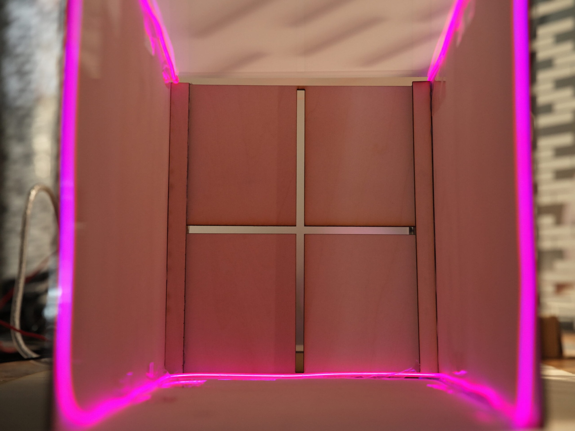 Night mode - EL wire outlining the interior of the model in a cool magenta glow