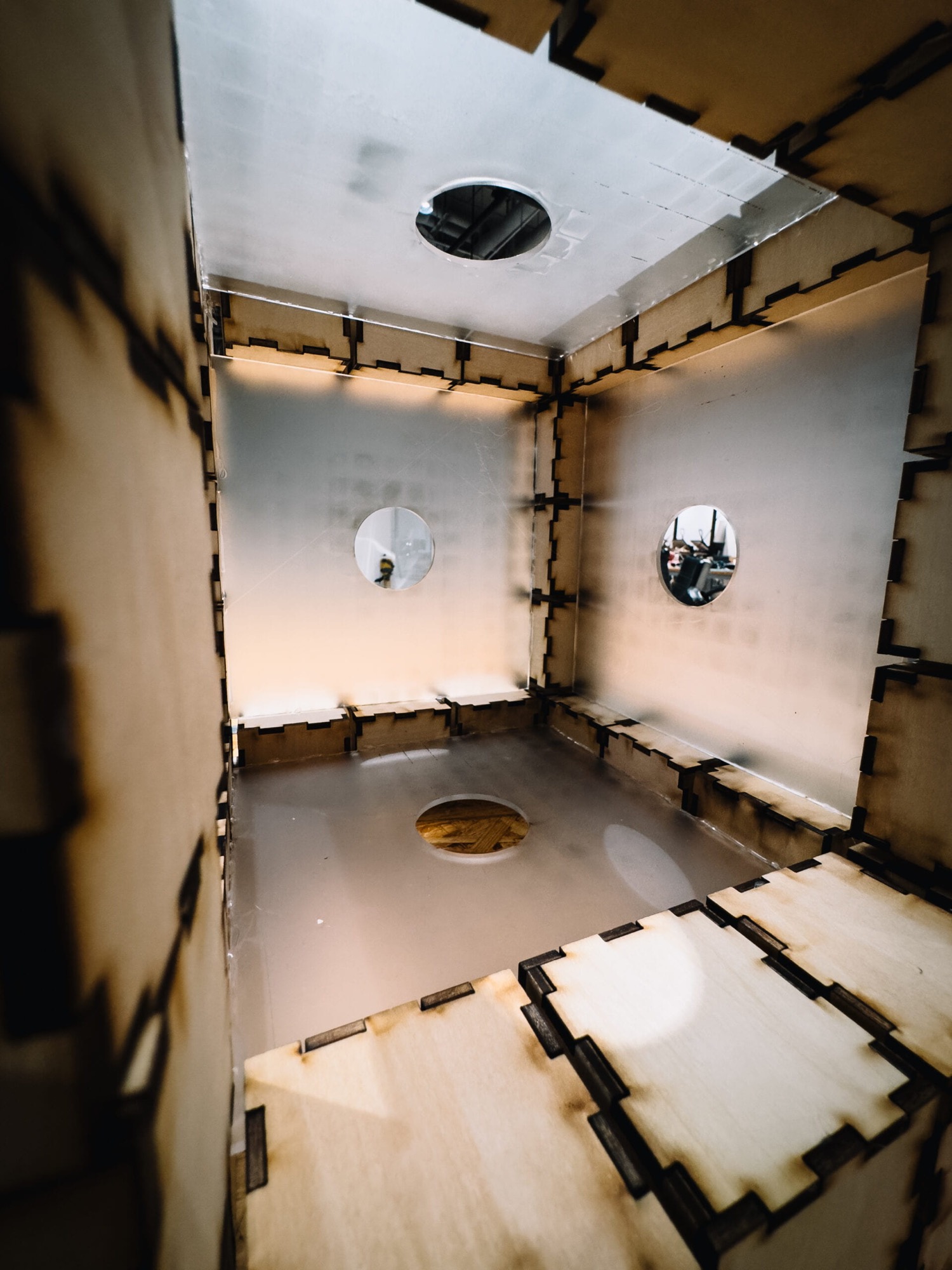 View into the cube's interior lined with translucent acrylic diffusion panels