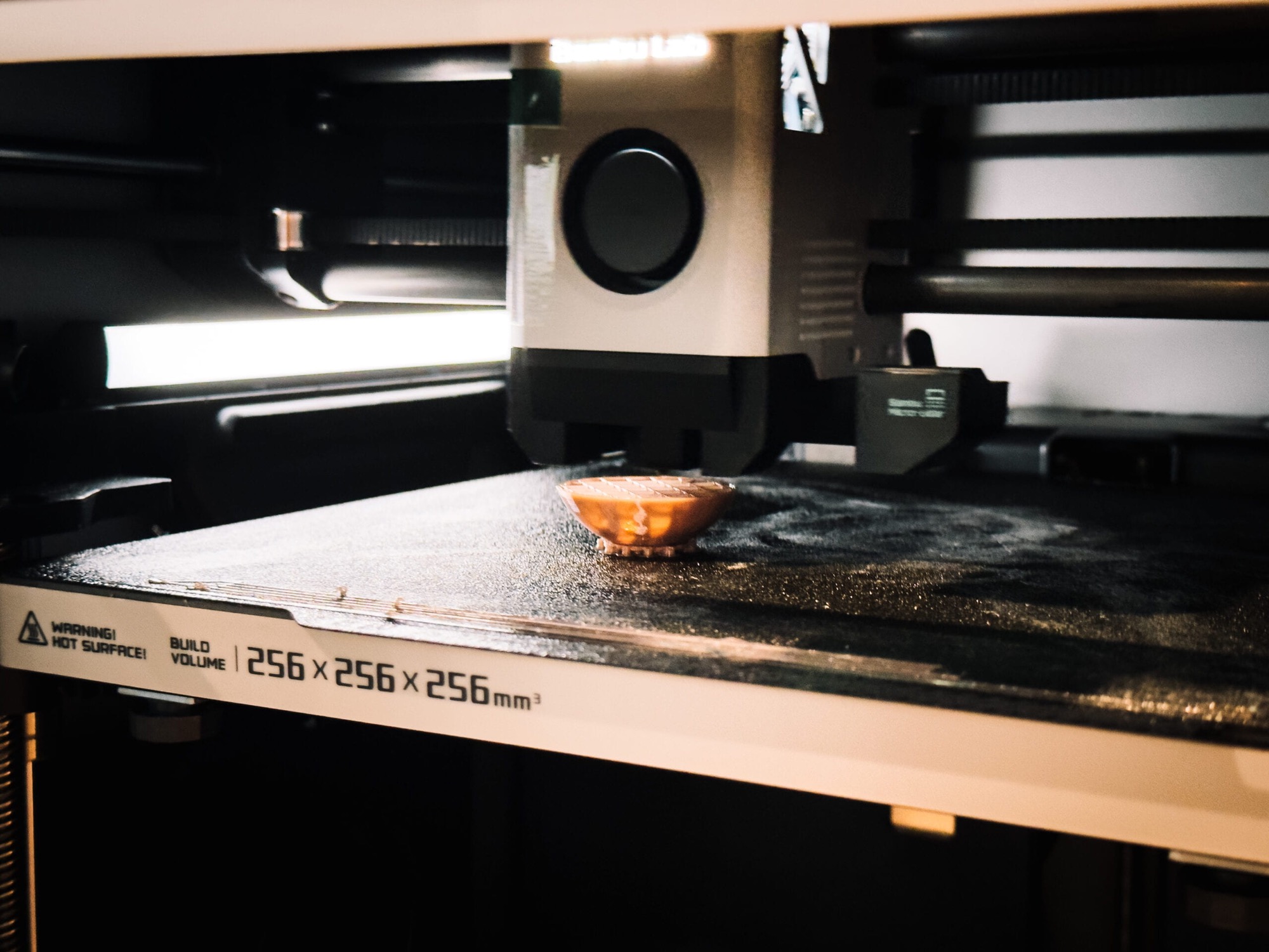 3D printer producing one of the balls that travel the tracks