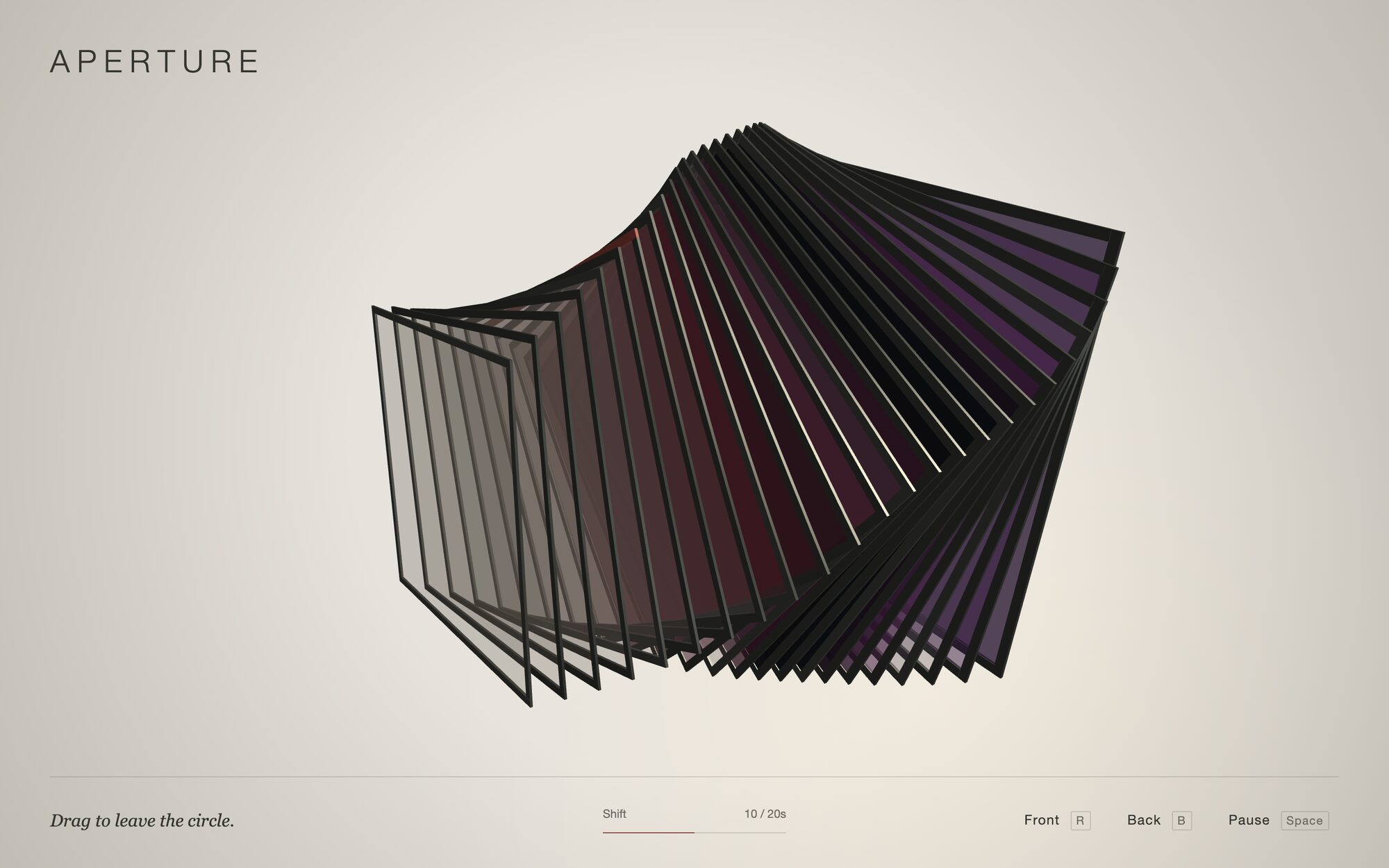 APERTURE from the side, closed: a band of dark panes runs through the fan, amber in front, red and magenta in the middle, violet at the back