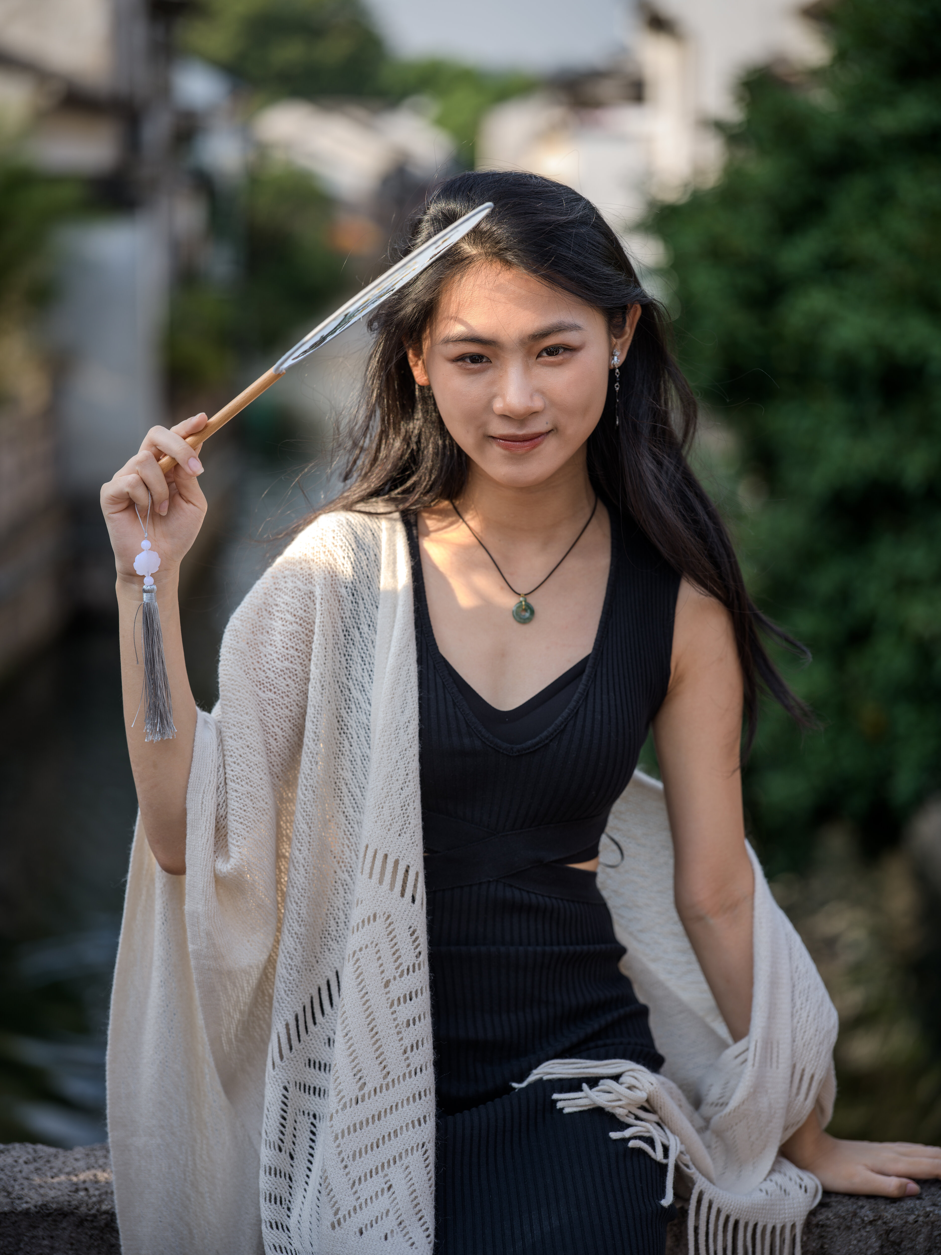 A silk fan by the old-town canal, Shaoxing, 2024