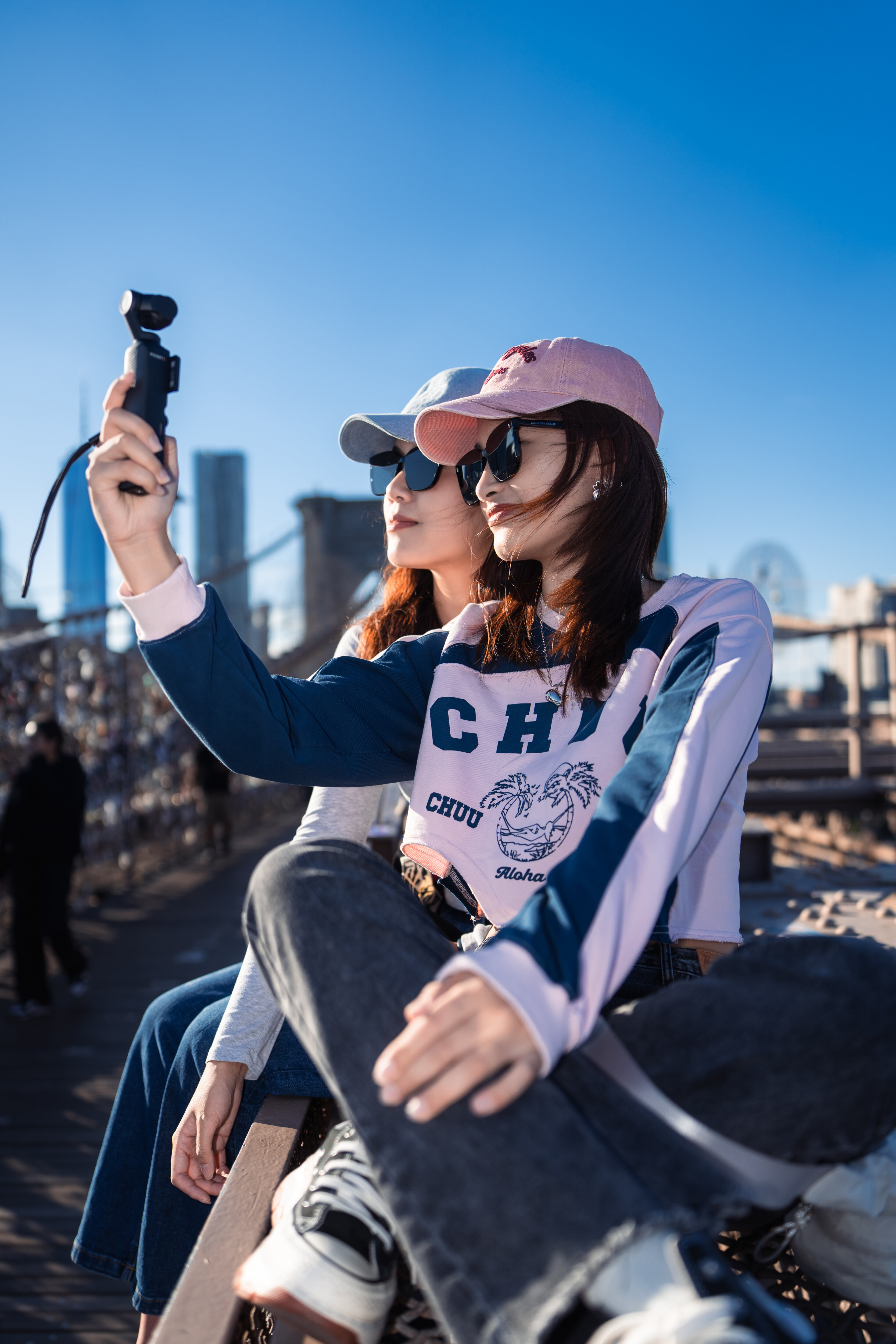 A selfie on the Brooklyn Bridge under a midsummer sky, New York, 2025
