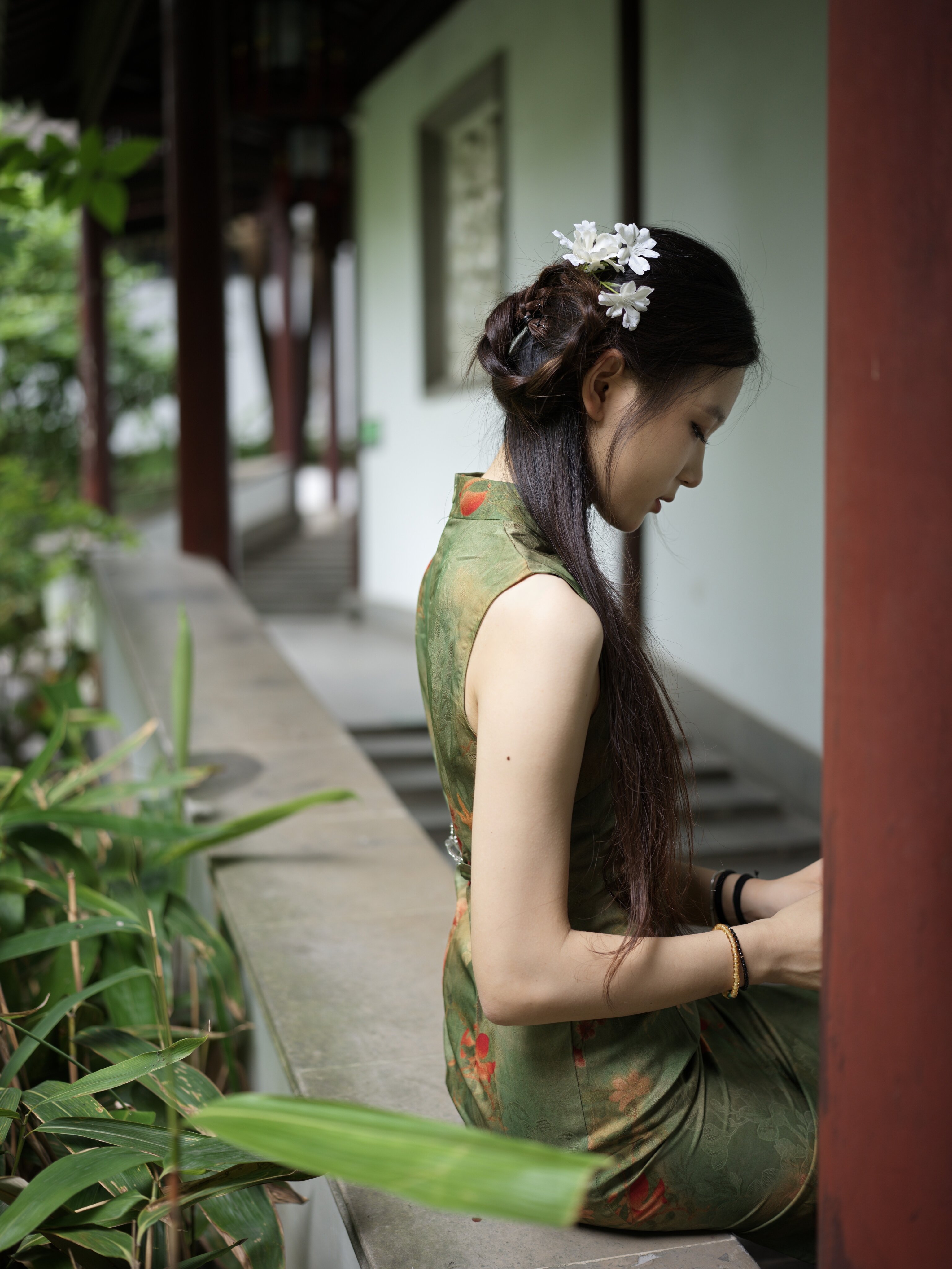 A green qipao in the corridor shade, classical garden, Nanjing, 2026