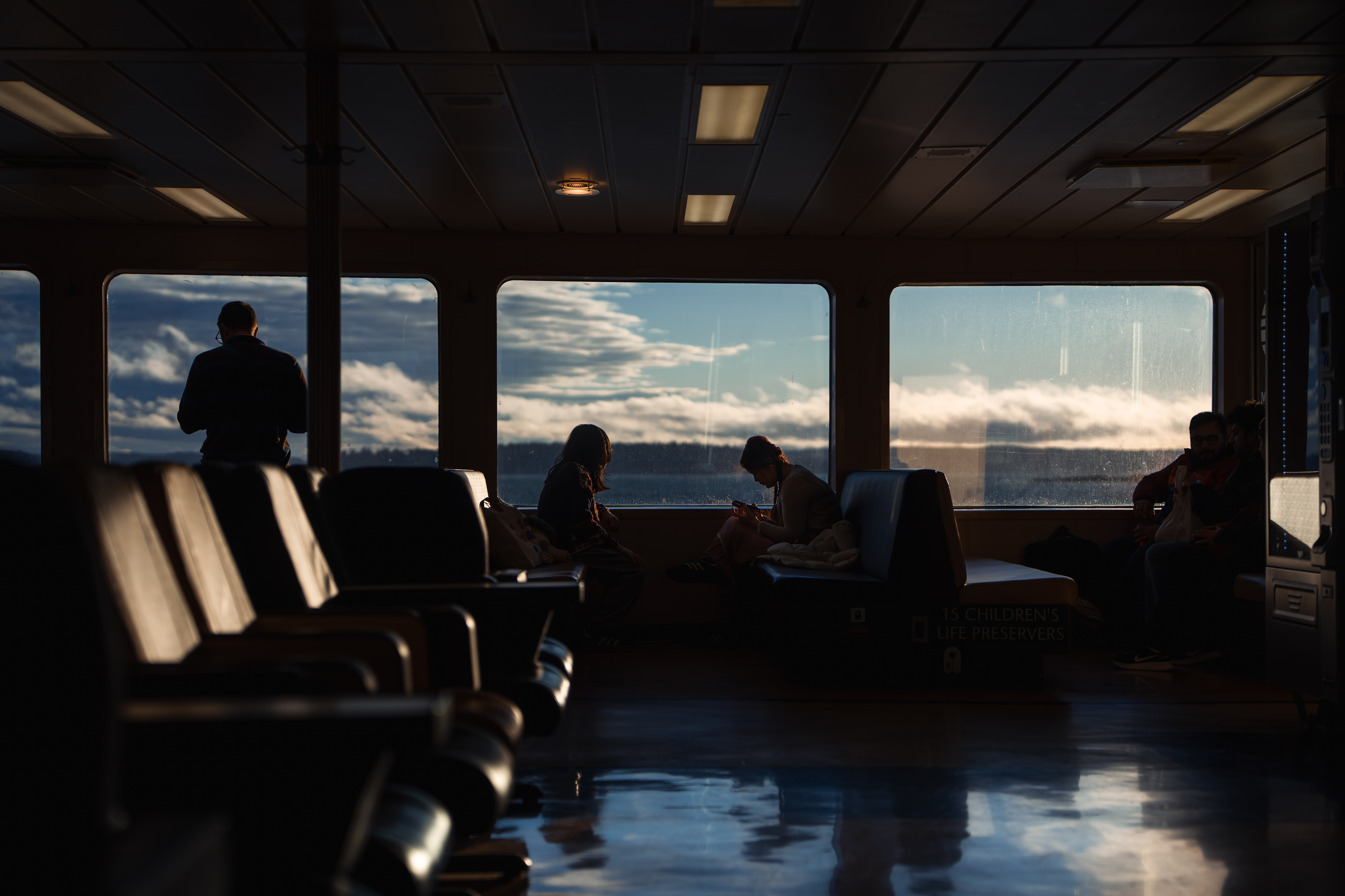 Person gazing through ferry window
