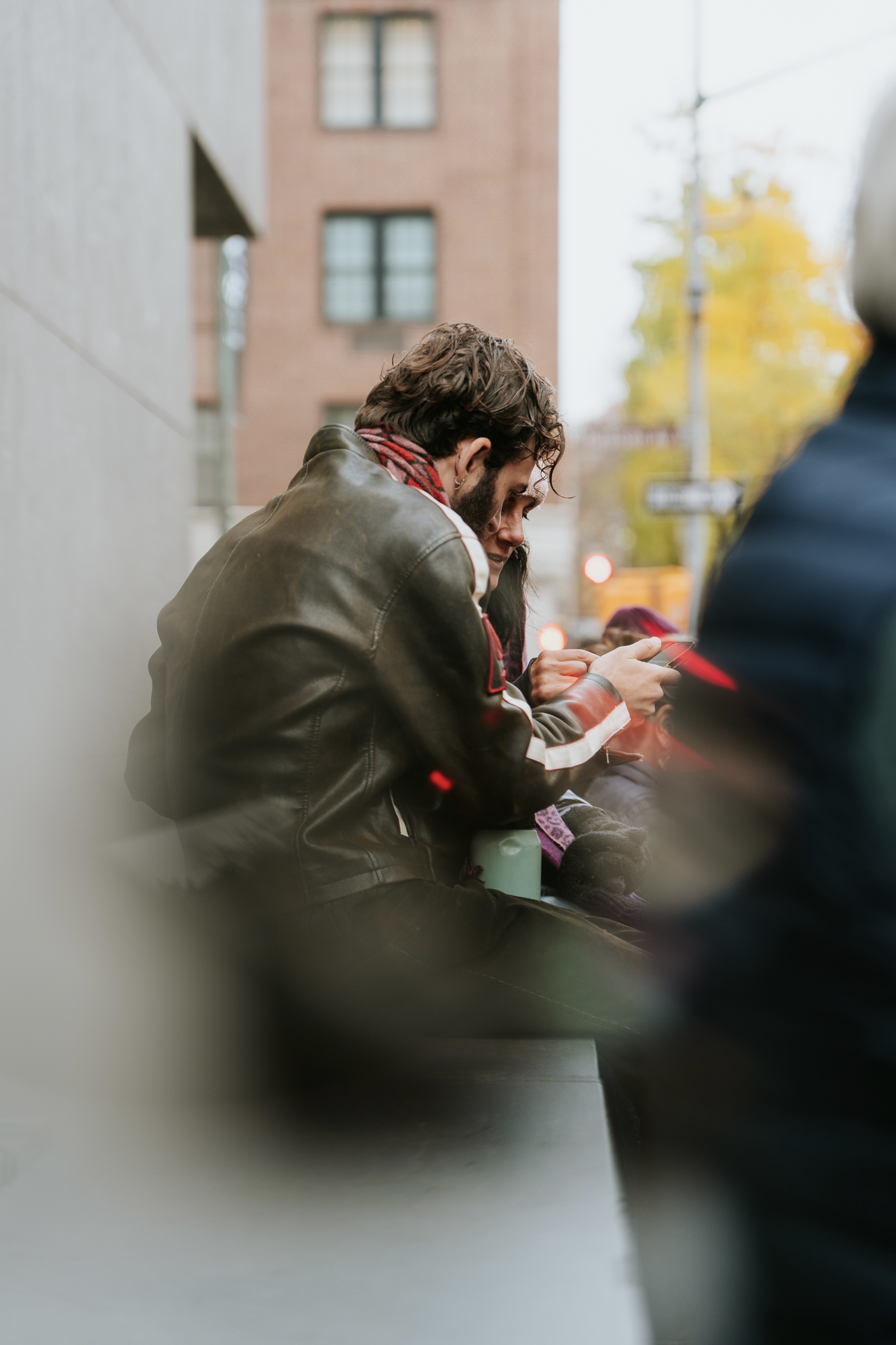 Couple sitting on gallery steps waiting