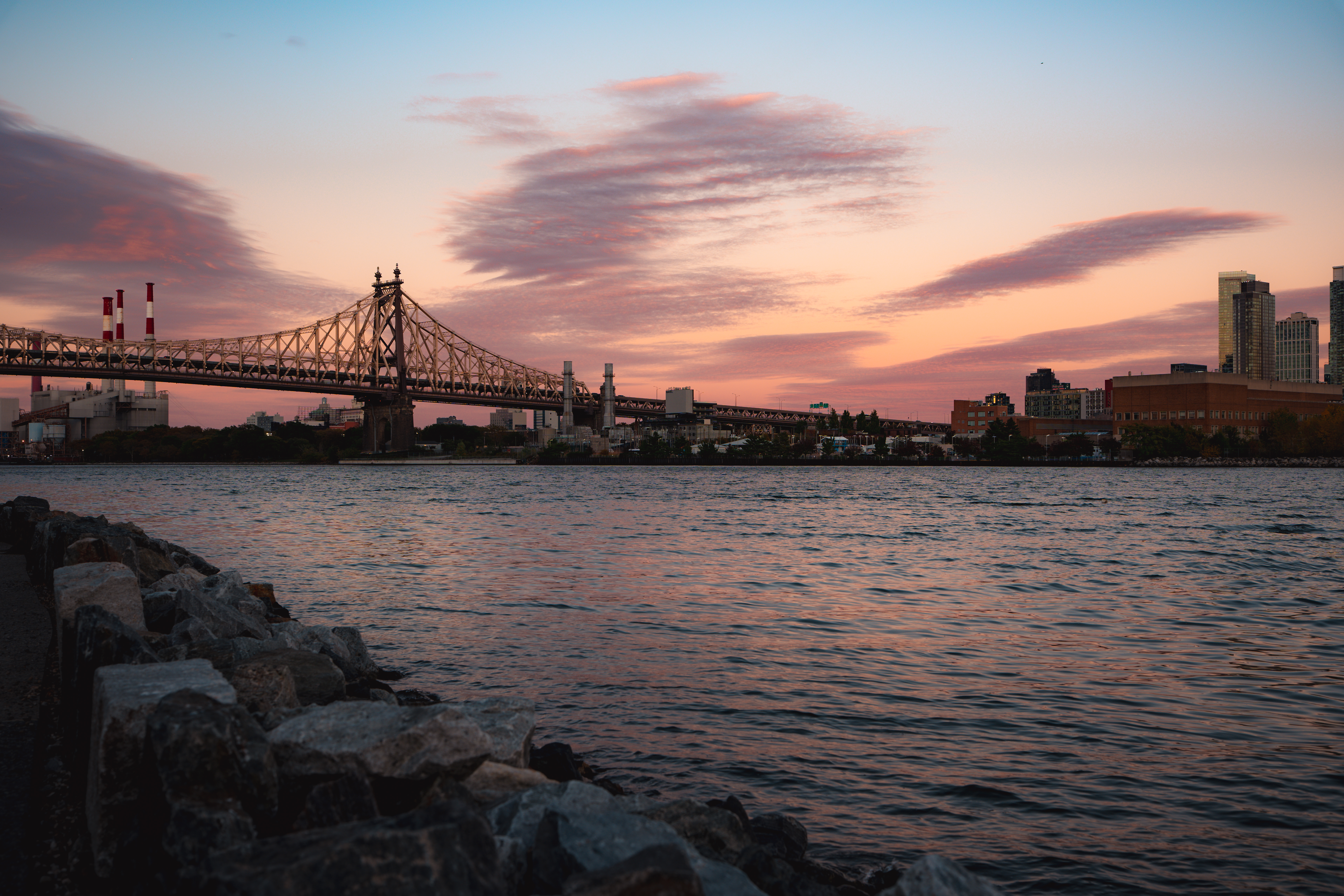 Pink sunset clouds over the Queensboro Bridge viewed from Roosevelt Island
